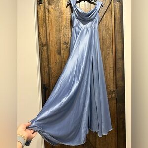 Size 3-4 light blue formal gown with built in bra. Corset fitted top.